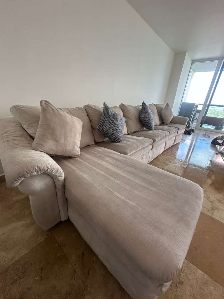 Beige chaise sectional in a Miami high-rise